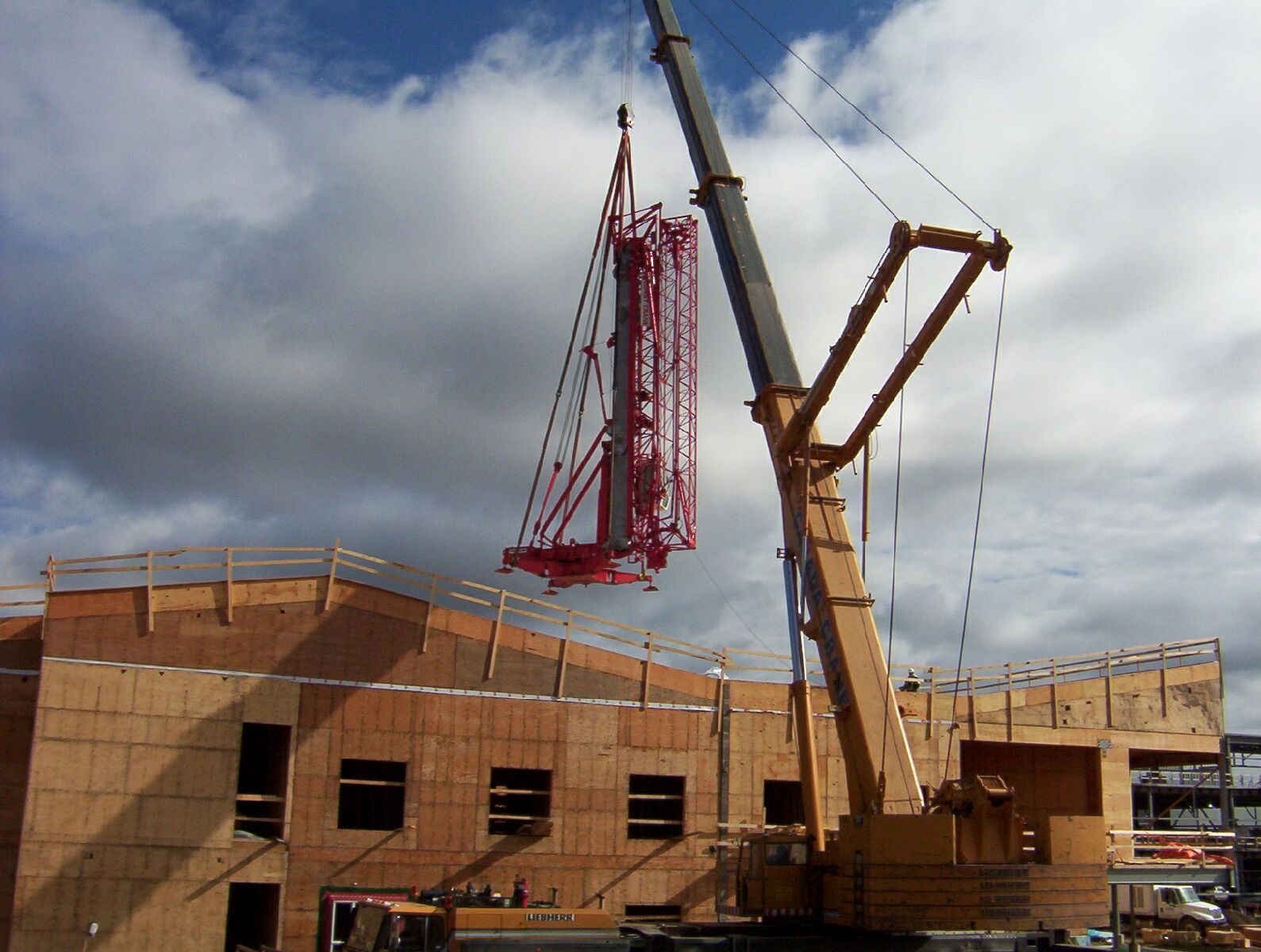 A 250-ton mobile crane placing the HDT-80 self-erecting crane on site